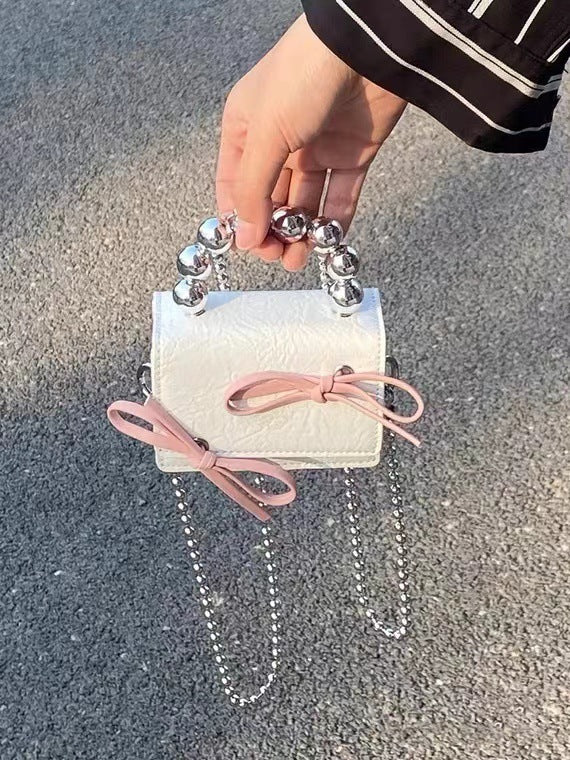 Textured Cute Bow Mini Chain Handbag - iztia